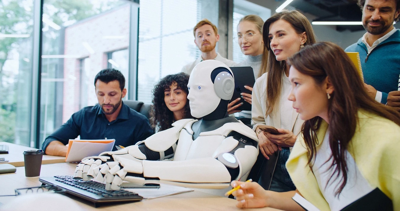Group of people collaborating with a robot in a modern office environment